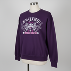 A vintage purple sweatshirt with a Desio crewneck design, featuring text and a graphic on the front.