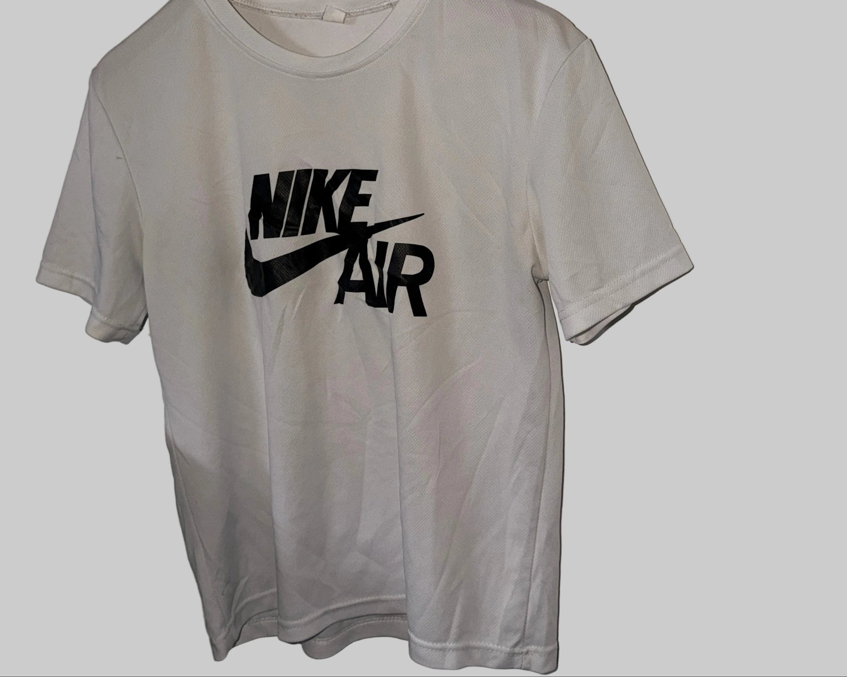 white Nike Air graphic t-shirt, similar to the Nike Sportswear Men's T-Shirt with model number DM6337-100.Size S  SKU 7471 