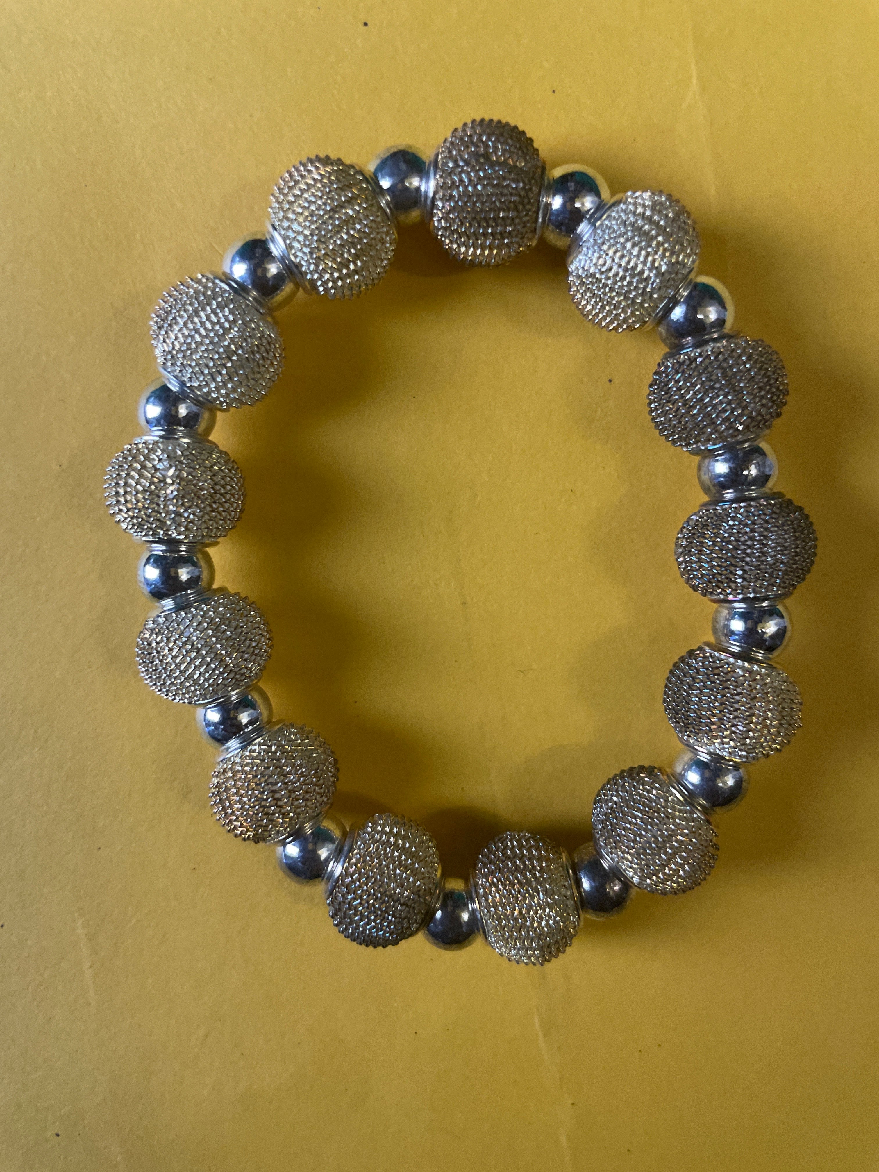 GOAH Cream and silver plated hand bead