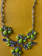 Silver chain women's necklace with flowery crystal and green pendant