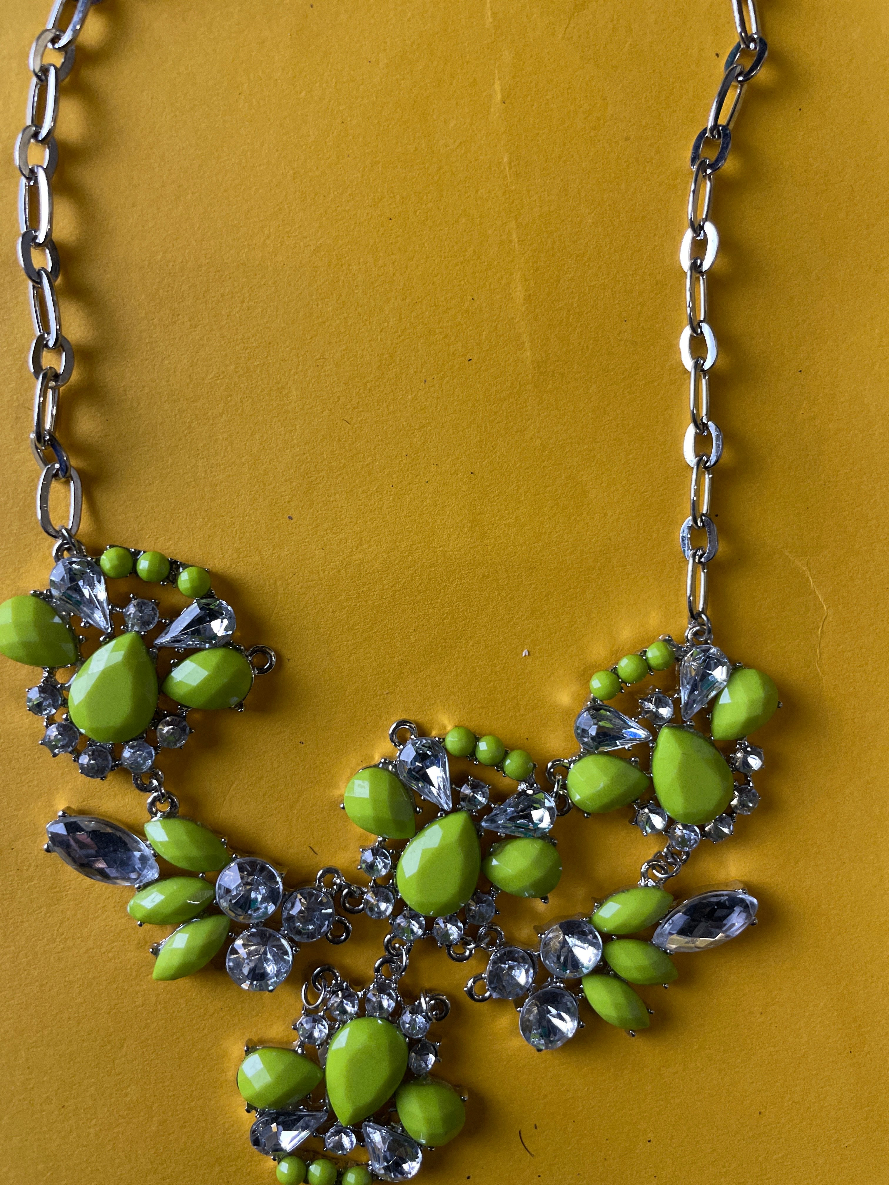 Silver chain women's necklace with flowery crystal and green pendant
