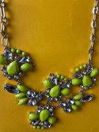 Silver chain women's necklace with flowery crystal and green pendant